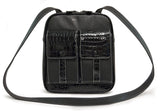 A black women's 10" Crossbody Tech organizer Messenger bag w/ faux crocodile accents. Has padded fur-lined pocket to store an iPad or 11" tablet. Made of vegan leather exterior w/ contrast stitching & plaid cotton-twill lining.