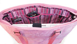 An open pink faux-suede 15"-17.3" Breast Cancer Awareness Tote w/ removable computer section for dual functionality. Detachable accessory/cosmetic purse.