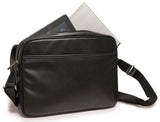 An open black 14"-15" Slimline Chromebook / Ultrabook Messenger bag w/ Koskin outer-shell material w/ contrast stitching & perforated accent panels. Has padded pockets for both 14.1” Ultrabook & an iPad or other popular tablet. Space for files & accessories, interior zippered pocket, full-length exterior pocket plus organizer, adjustable shoulder strap w/ polished nickel fittings.