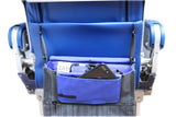 A grey in-flight travel organizer TAB messenger V2 bag w/ black shoulder strap & Blue lining inside airplane seat back pocket.