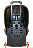 A black gogokidz Original Travelmate w/ razor wheels, fold down plate & telescopic handle & kids car seat attached.