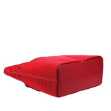 Side view of large red ballistic nylon Sumo Large Tote / diaper bag w/ white stitching, faux-leather detail, Interior & Exterior pockets all around, Magnetic Closures & Printed liner