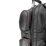 A side view of ballistic nylon black 16" Gaming Checkpoint Friendly Backpack w/ red trim & velcro front panel, padded air-mesh shoulder straps & back panel, padded carry handle & trolley strap for stacking on other luggage. Shows embedded USB port & exterior pockets.