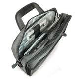 An open 16" Graphite Corporate Briefcase w/ three exterior padded pockets, padded handles & shoulder strap showing tech gear, files & tablet inside pockets
