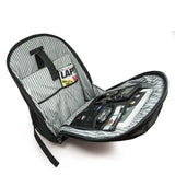 An open 17.3" Graphite Laptop Backpack w/ padded shoulder straps, Padded Computer Compartment, Removable ID Holder w/ Multiple Anchor Locations, Custom Molded Fasteners & Padded Back Panel