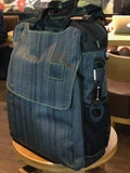 A suit grey Walter and Ray InTransit SLIM travel convertible backpack w/ carabiner.