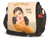 This is a peach 14.1" Maddie Powers Pulp Fiction Laptop Bag w/ pulp magazine images doubles as a tote bag w/ removable laptop sleeve, soft velveteen trim & old Hollywood style.