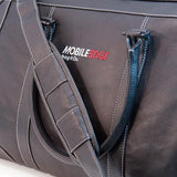 A black leather duffel w/ ruggedized bottom panel & matching leather shoulder strap