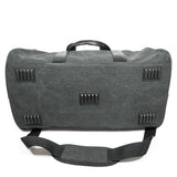 A charcoal cotton canvas duffel w/ black leather trim, inner lining & shoe compartment