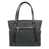 Two charcoal 15.6" Urban Laptop Tote w/ brown leather trim, handles, & padded computer compartment.